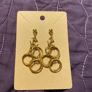 Gold earrings with a cluster of dangly rings